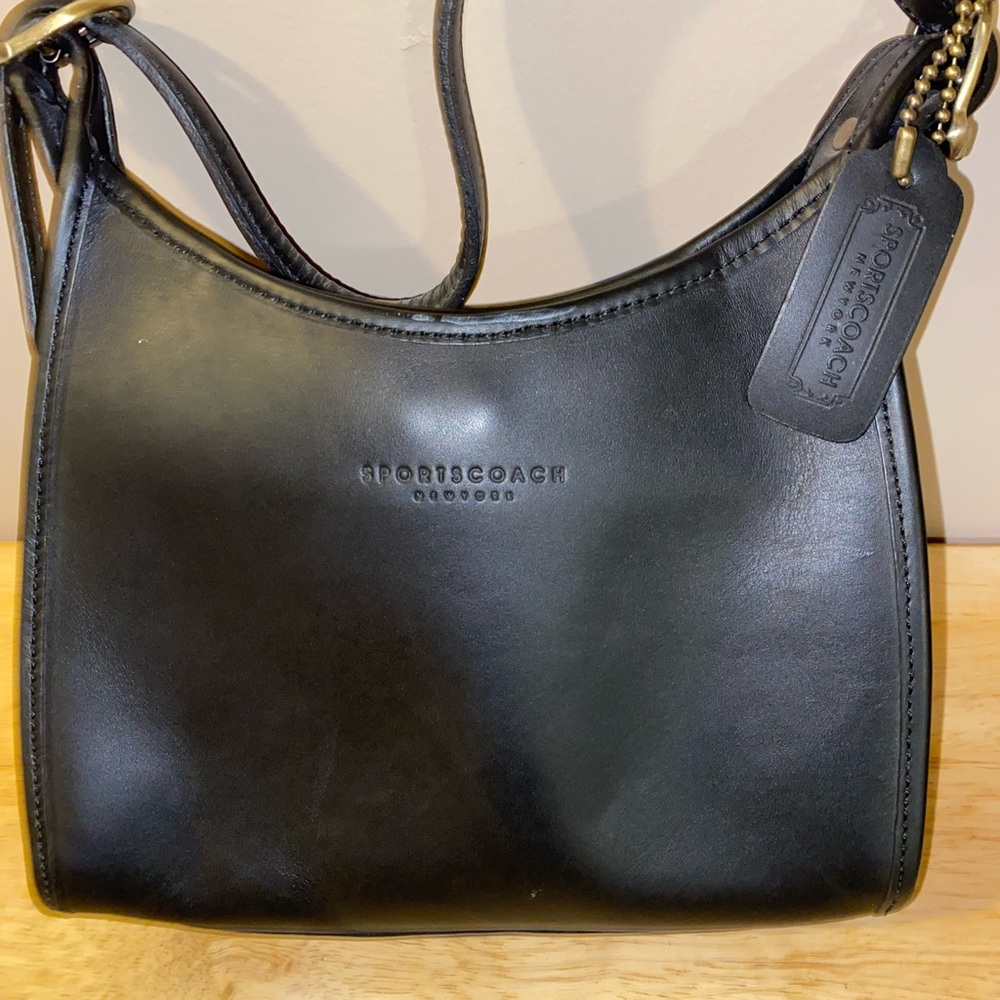New black Coach leather purse.